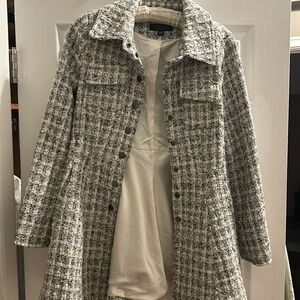 Snug fit, pea coat style, snapped button jacoat( can be worn as a jacket or coat